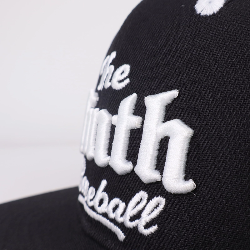 Close-up of 3D puff embroidery on a black custom cap showing tight stitching and foam density