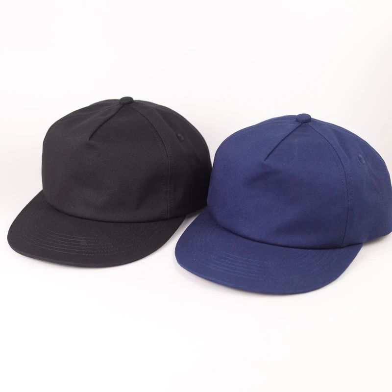 Black and navy cotton short-brim six-panel caps shown together