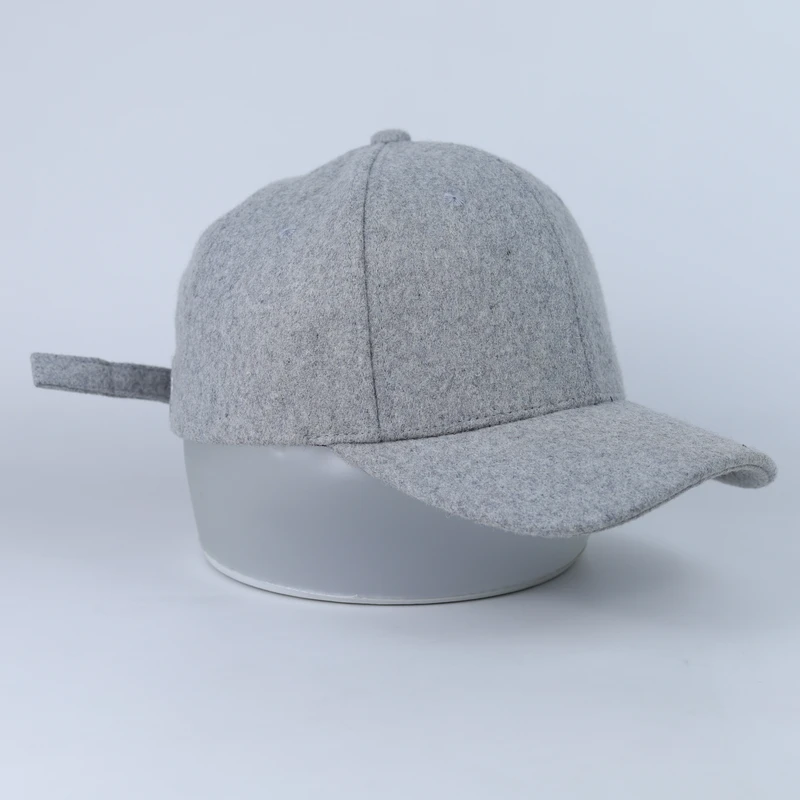 Grey blank curved-brim cap with a felt-like surface viewed from the front side