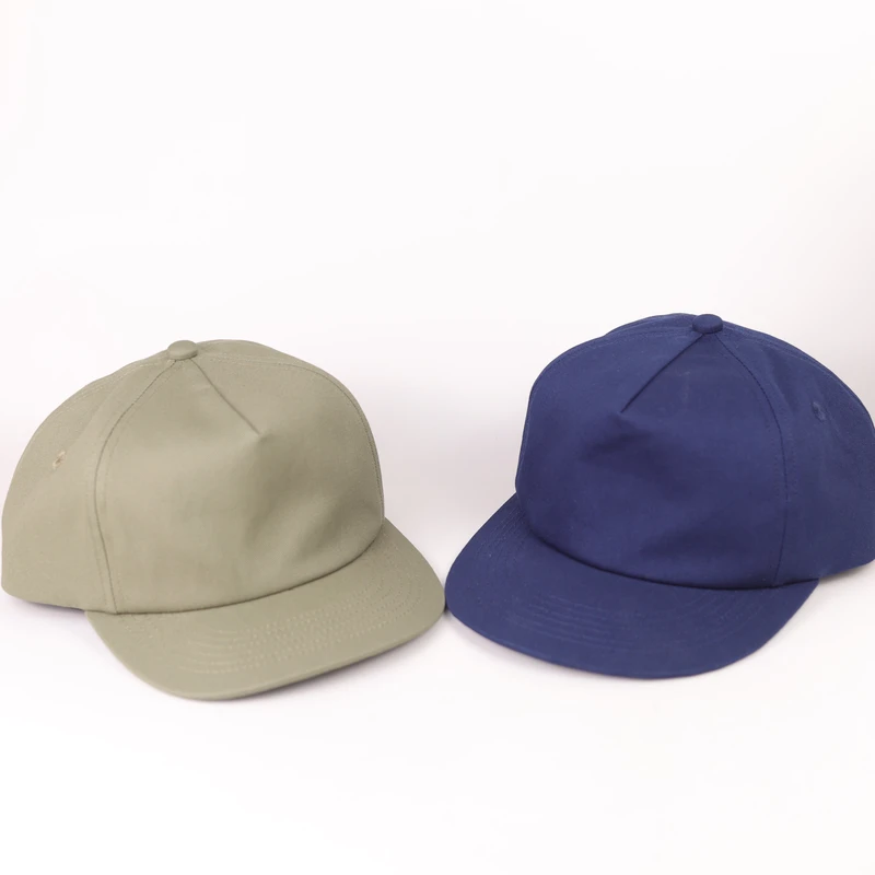 Khaki and blue blank compact-brim caps shown side by side